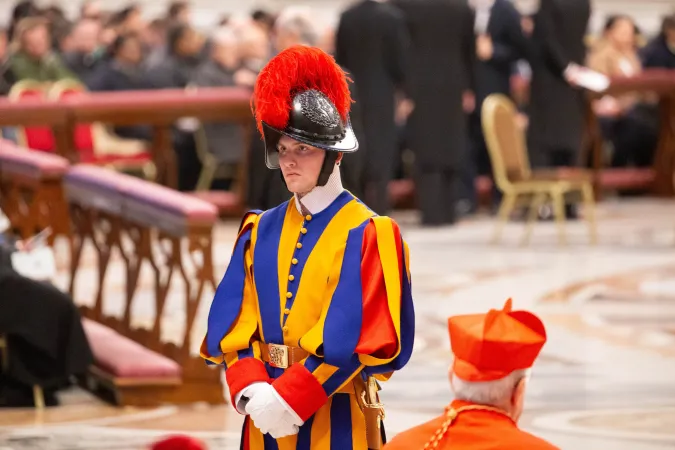 A member of the Pontifical Swiss Guard stands at attention during the First Vespers celebration at St. Peter's Basilica. Vatican City, Feb. 1, 2025.