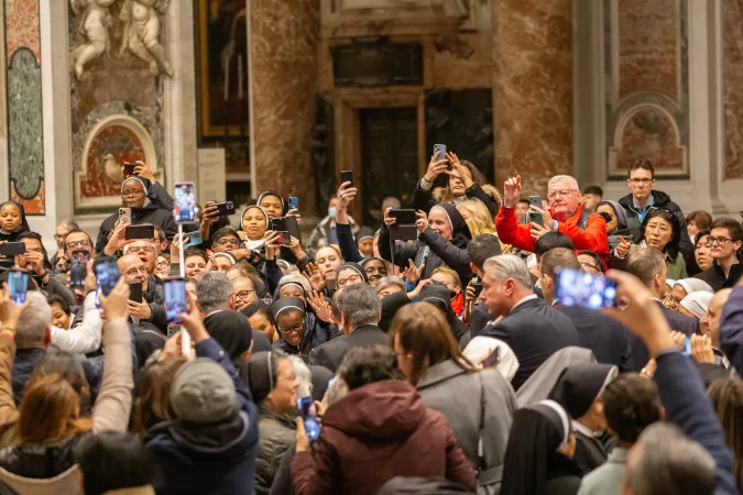 Consecrated men and women capture moments from Pope Francis’ passage through St. Peter’s Basilica during the celebration of First Vespers. Vatican City, Feb. 1, 2025.