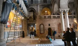 The interior of the Basilica of the Holy Sepulcher in Jerusalem. In the center, the Stone of Anointing, with Calvary in the background. | Credit: Marinella Bandini
