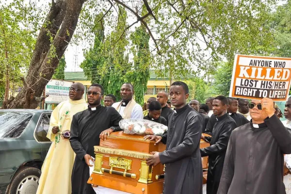 Nigerian Archbishop Cries at Gravesite of Slain Prest as Catholics Protest Violence