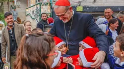 Children greet the Latin patriarch of Jerusalem, Cardinal Pierbattista Pizzaballa, during his visit to Gaza’s Holy Family Parish on Dec. 19, 2025. / Credit: Photo courtesy of the Latin Patriarchate of Jerusalem