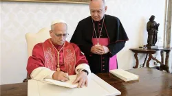Pope Leo XIV signs his first apostolic exhortation, 'Dilexi te', at the Vatican, Saturday, Oct. 4, 2025 / Credit: Vatican Media