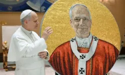 Pope Leo XIV next to the new mosaic of him that will be added to St. Paul Outside the Walls Basilica in Rome. | Credit: Vatican Media