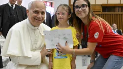 Pope Leo XIV receives a drawing from a girl participating in the “Estate Ragazzi in Vatican” summer camp on July 3, 2025, at the Vatican. / Credit: Vatican Media