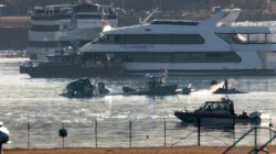Emergency response units search the wreckage on Jan. 30, 2025, of an American Airlines plane on the Potomac River after it crashed on approach to Reagan National Airport the night before. The American Airlines flight from Wichita, Kansas, collided midair with a military Black Hawk helicopter while on approach to Ronald Reagan Washington National Airport. According to reports, there were no survivors among the 67 people on both aircraft. / Credit: Alex Wong/Getty Images