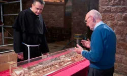 From the opening of St. Francis of Assisi’s tomb in 2015, showing the then-custos of the Sacred Convent, Father Mauro Gambetti, inspecting the remains of the saint’s body. | Credit: Photo courtesy of the Sacred Convent of Assisi