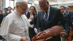 Pope Leo XIV views a gift from an attendee at the International Catholic Legislators Network meeting at the Vatican, Saturday, Aug. 23, 2025. / Credit: Vatican Media