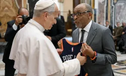 Film director Spike Lee gives Pope Leo XIV a customized New York Knicks jersey at the Vatican on November 15, 2025. / Vatican Media