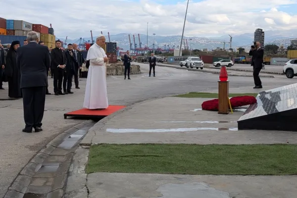 Pope Leo XIV prays in silence at the site of the 2020 port explosion in Beirut, Lebanon, on December 2, 2025. / AIGAV Pool