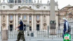 People wearing face coverings walk past St. Peter’s Basilica. Daniel Ibáñez/CNA.
