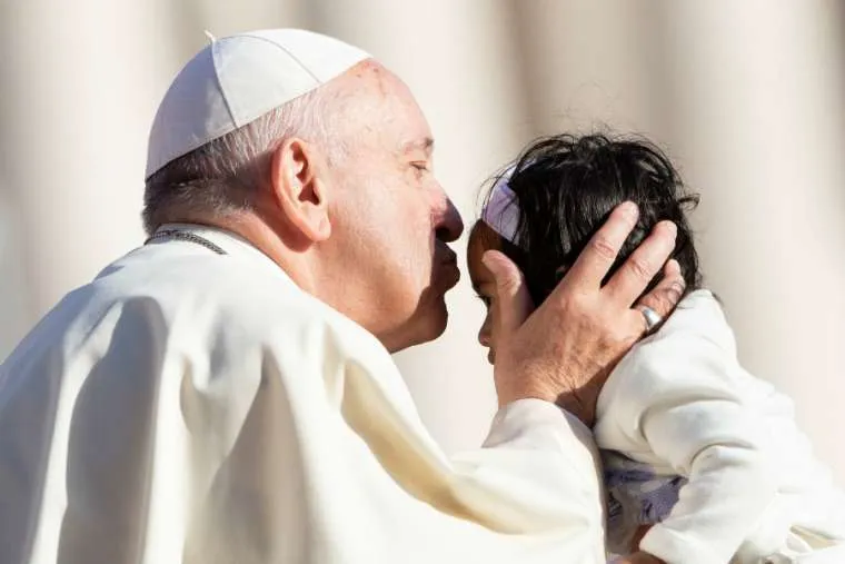 Pope Francis kisses a child at the general audience on Oct. 10, 2018. Credit: Daniel Ibanez/CNA.