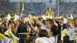 A young boy waves a Thai flag before Mass with Pope Francis in Bangkok, Thailand. Credit: Hannah Brockhaus/CNA.