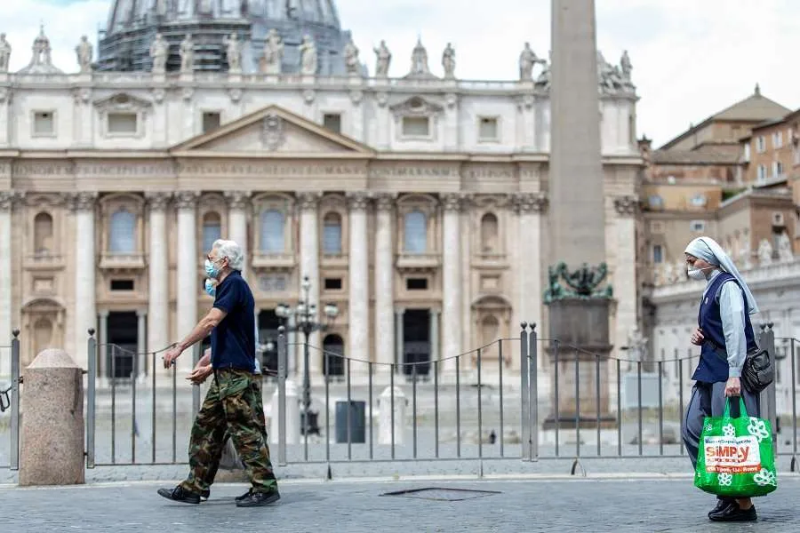 People pass in front of St. Peter's Basilica at the end of May. Credit: Daniel Ibanez/CNA.