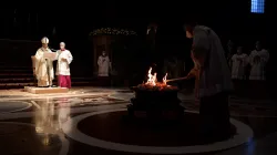 Pope Francis prays before the Easter fire in St. Peter's Basilica on April 3, 2021. / Vatican Media/CNA