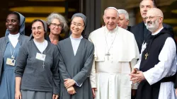 Sr. Alessandra Smerilli (second from left) and Sr. Nathalie Becquart (third from left) pose with Pope Francis and others during the youth synod in 2018. Daniel Ibáñez / CNA
