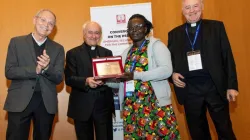 Magdalen Awor receiving the Guardian of Life Award 2023 from the Pontifical Academy of Life in Rome on 22 February 2023. From left: Don Dante (Doctors with Africa CUAMM Director), Archbishop Vincenzo Paglia (president of the Pontifical Academy for Life), Magdalen Awor, and Mons. Renzo Pegoraro (Chancellor of the Pontifical Academy for Life). Credit: Pontifical Academy for Life