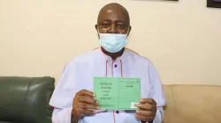 Bishop Callistus Valentine Onaga of the Catholic Diocese of Enugu in Nigeria holds his vaccination card after receiving the COVID-19 vaccine. / Diocese of Enugu