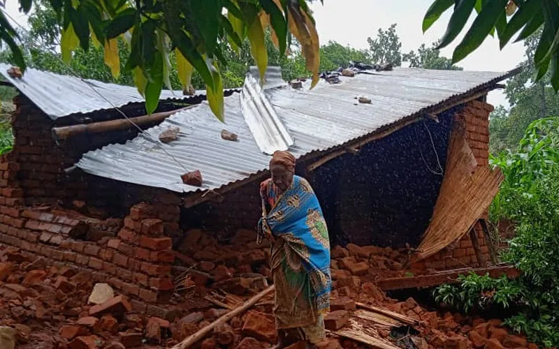 An elderly woman in front of her destroyed house in TA Mlumbe Zomba. Credit: CADECOM