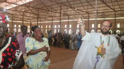 Cheerful Bishop Christian Carlassare blessing the faithful at Holy Family Parish Church, Rumbek, after consecrating the Catholic Diocese of Rumbek to the Immaculate Heart of Mary. Credit: Fr. Wanyonyi Eric Simiyu, S.J/Rumbek