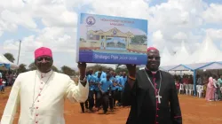 Bishop Paul Kariuki Njiru of Wote Diocese in Kenya (left) and Bishop John Mbinda of Kenya's Lodwar Diocese (right) display a demo version of the 2023-2028 Strategic Plan for the Holy  Ghost Schools - Makueni in Wote Diocese on 10 February 2024. Credit: ACI Africa