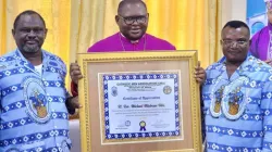 Members of the Catholic Men Association (CMA) in Cameroon’s Diocese of Buea present a certificate of appreciation to Bishop Michael Miabesue Bibi. Credit: Buea Diocese