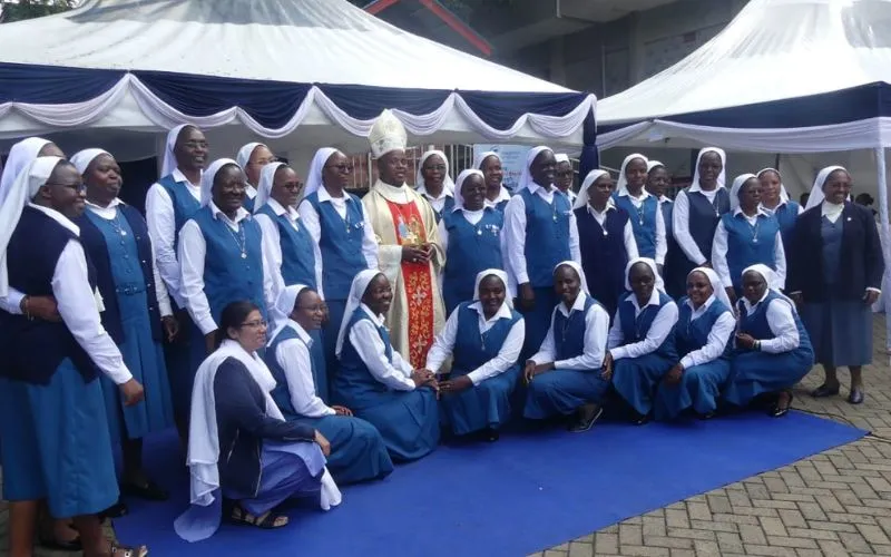Bishop Joseph Mwongela of Kenya's Kitui Diocese poses for a photo with Pauline Sisters on Friday, 5 April 2024 after perpetual profession of their three members. Credit: ACI Africa.