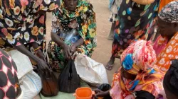 South Sudanese teturnees receiving food relief in Abiemnhom, near the border with war-torn Sudan in March 2024. Credit: Sr. Elena Balatti