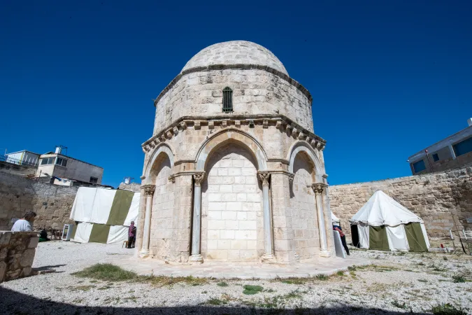 The back of the Chapel of the Ascension on the Mount of Olives in Jerusalem. On the sides, two of the four tents set up for the occasion by the Custody of the Holy Land are visible. They serve to accommodate the sacristy, pilgrims, and a small field kitchen. May 8, 2024.