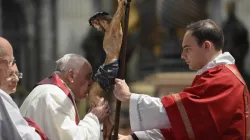 Pope Francis kisses the crucifix at the Liturgy of the Lord's Passion in St. Peter's Basilica on April 7, 2023. | Vatican Media