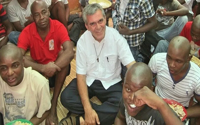 Fr. Antonio Perretta, director of Casa da Misericórdia, Archdiocese of Maputo in Mozambique, with inmates in one of the prisons in Maputo.