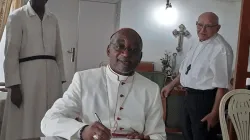 Archbishop Jean Patrick Iba-ba signing the Bull of nomination, on April 12, 2020, in Libreville. / Eglisecatholique-gabon.org