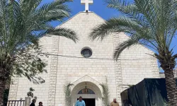 People gather at the Roman Catholic Church of the Holy Family on Palm Sunday in al-Zaitoun neighborhood of Gaza City on March 24, 2024, amid the ongoing conflict between Israel and the Palestinian Hamas movement. / Credit: AFP via Getty Images