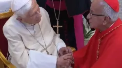 Pope Emeritus Benedict XVI greets Colombian Cardinal Jorge Enrique Jiménez Carvajal at the retired pope's Vatican residence on Aug. 27, 2022. | Screenshot from EWTN video