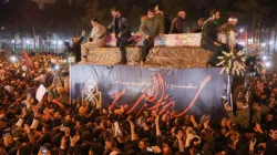 Iranians gather around the caskets of Qasem Soleimani and others during a funeral procession after the bodies arrived in Qom, Jan. 6, 2020. / Mehdi Marizad/Fars News/AFP via Getty Images