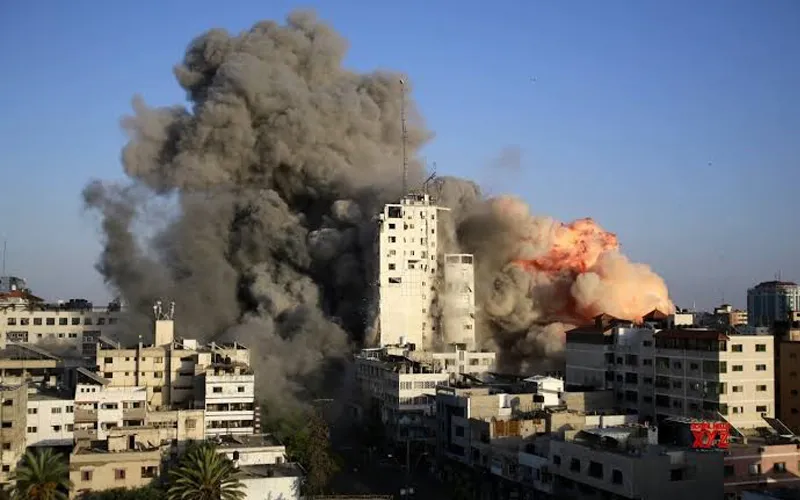 Image of buildings burning in the ongoing Israeli-Palestinian violence. Credit: Courtesy Photo