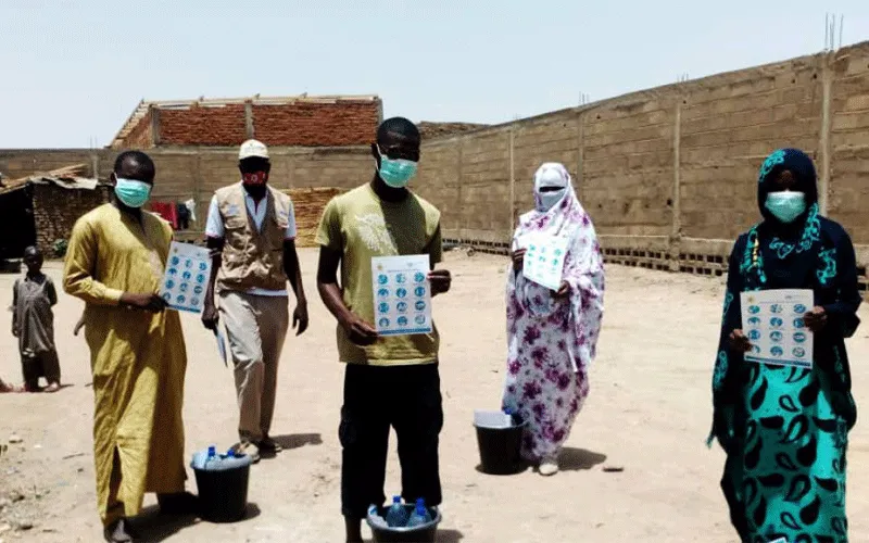 JRS teachers in Chad with some of the posters and information materials they are using to create awareness about COVID-19 among the refugee communities. / Jesuit Refugee Service (JRS)