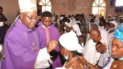 Archbishop Ignatius Kaigama administers the Sacrament of Confirmation at  St Joseph Mukasa’s Parish of Abuja Archdiocese. Credit; Abuja Archdiocese