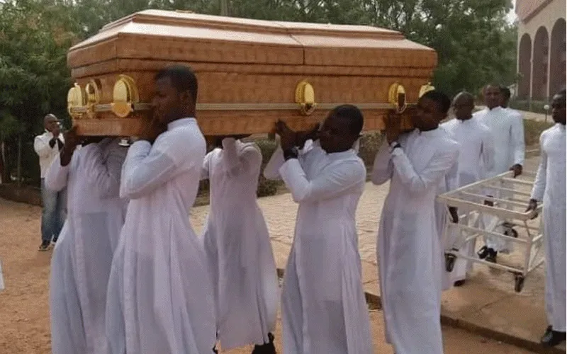 Seminarians carry the coffin of their murdered colleague, Michael Nnadi during his burial on February 11.
