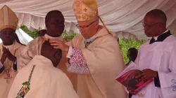 Archbishop Hubertus van Megen lays hands on the head of Bishop George Muthaka, during his episcopal ordination May 7 at Our Lady of Consolation Cathedral of Garissa Diocese grounds. Credit: Garissa Diocese