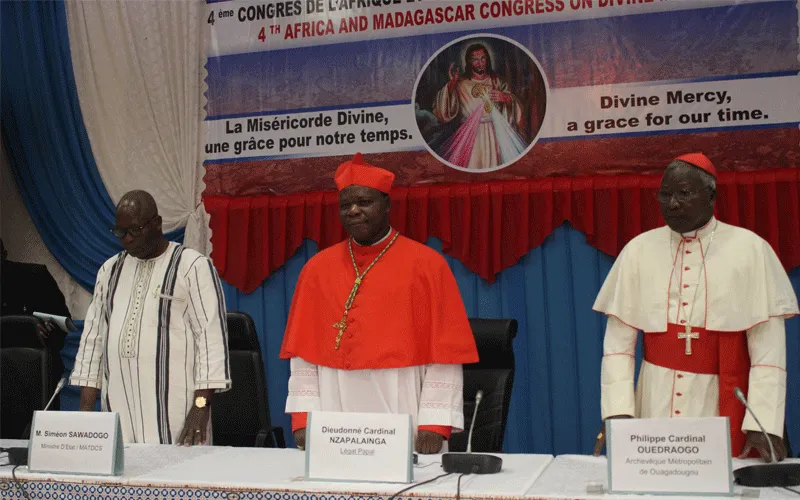 Dieudonne Cardinal Nzapalainga (Center), Philippe Cardinal Ouedraogo (Right), Simeon Sawado (Left), observing a minute of Silence for the victims  of terrorism in Burkina Faso, during the Opening Ceremony of the 4th Pan-African Congress on Divine Mercy in Ouagadougou on November 19, 2019 / ACI Africa