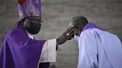 Bishop John Oballa Owaa places ashes on a Priest's forehead during Ash Wednesday Mass. Credit: Ngong Diocese