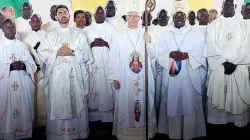 Archbishop Hubertus van Megen, Bishop Eduardo Hiiboro Kussala, the three newly ordained Priests, and other Priests after the April 30 Holy Mass. Credit: CDTY
