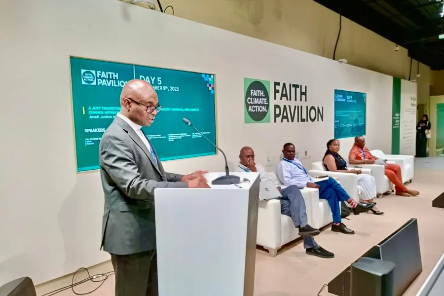 Fr. Charles Chilufya S.J, Director of the Jesuits Justice and Ecology Network Africa opens the session on the need for an ethically-informed approach to achieving justice in mining and facilitating a just transition at COP 28 Faith Pavilion. Credit: JENA/PACJA