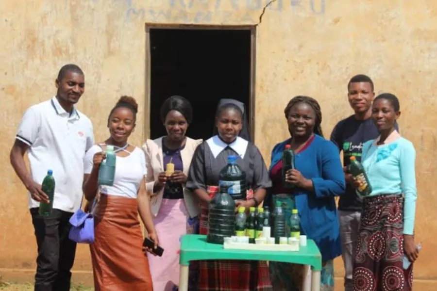 Sr. Teresa Mulenga with some community members displaying locally made soap. Credit: Sr. Teresa Mulenga