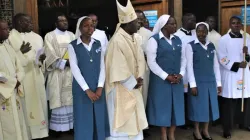 Archbishop Kivuva with three FSP members after taking perpetual vows outside Consolata Shrine. Credit: ACI Africa