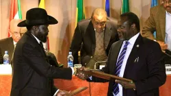 South Sudan's President Salva Kiir (left) and Vice-president Riek Machar (right) shake hands at the signing of the Revitalized Agreement on the Resolution of Conflict in South Sudan (R-ARCSS) in September 2018.
