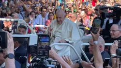 Pope Francis makes his way past crowds of thousands on his way to the World Youth Day welcoming ceremony in Lisbon, Portugal, Aug. 3, 2023. | Credit: Pablo Pilco/EWTN News