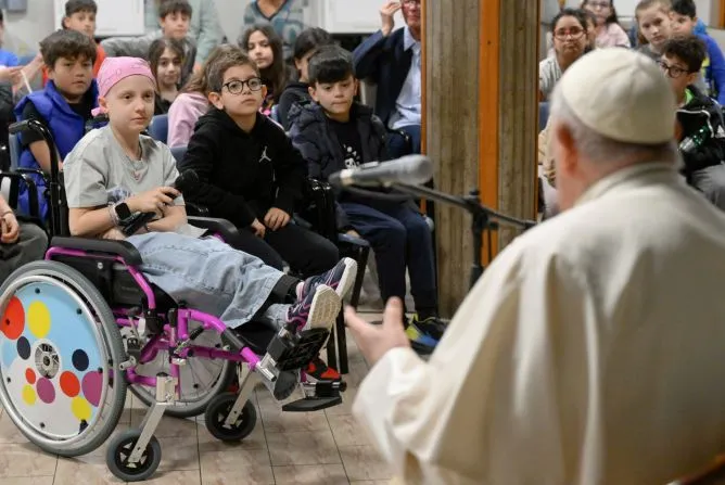 Pope Francis visits with children of St. John Vianney parish in Rome's Borghesiana district.