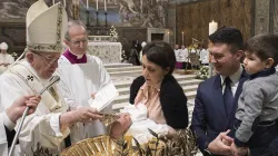 Francis baptizes a child in the Sistine Chapel on Jan. 12, 2020. / Vatican Media