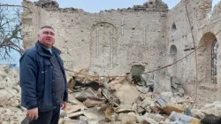 Father Oleksandr Repin among the church ruins | Benedictine Missionary Sisters
